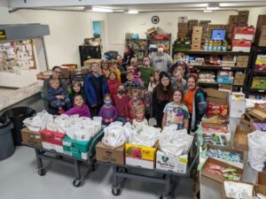 Children volunteering at the Augusta Food Bank