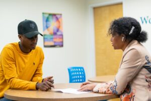 Man talking to a woman counselor.