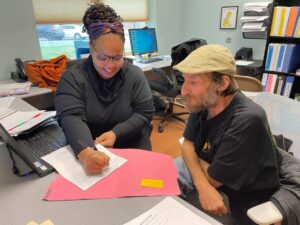 Woman counselor speaking with a man