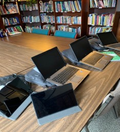 Computers on a desk in the library.